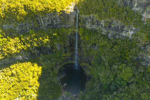 aerial view taken by drone of do Risco waterfall during a sunny spring day, Madeira, Portugal, Europe