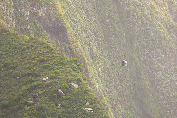 a typical Madeira's cable car enveloped in warm light during a spring sunset, Madeira, Portugal, Europe