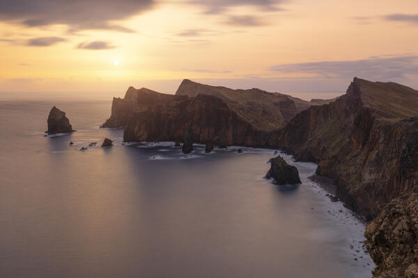 a long exposure to capture the warm light of the sunrise in Sao Lourenco peninsula during a spring day, Madeira, Portugal, Europe