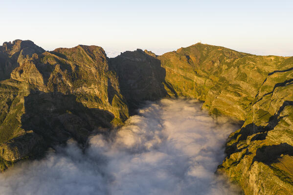 aerial view taken by drone of Pico do Arieriro during a warm spring sunset, Madeira, Portugal, Europe
