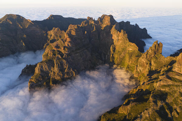 aerial view taken by drone of Pico do Arieriro during a warm spring sunset, Madeira, Portugal, Europe