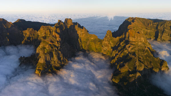 aerial view taken by drone of Pico do Arieriro during a warm spring sunset, Madeira, Portugal, Europe