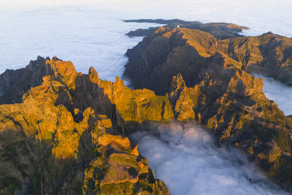 aerial view taken by drone of Pico do Arieriro during a warm spring sunset, Madeira, Portugal, Europe