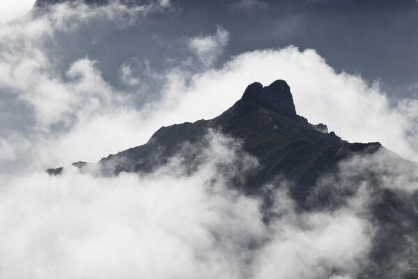 the top of the mountain emerges from the clouds during a spring day, near Pico do Arieriro, Madeira, Portugal, Europe