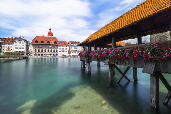View of the Kapellbrücke bridge and the Wasserturm over the Reuss river, during a sunny summer day, Lucerne, canton of Lucerne, Switzerland