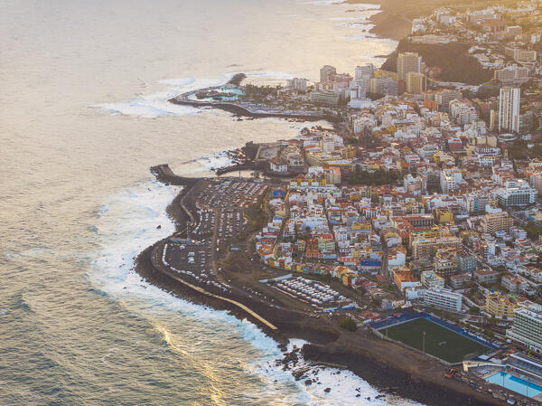 aerial view taken by drone of the coastal city of Puerto de la Cruz, during a beautiful sunrise, Tenerife, Canary Island, Spain, Europe