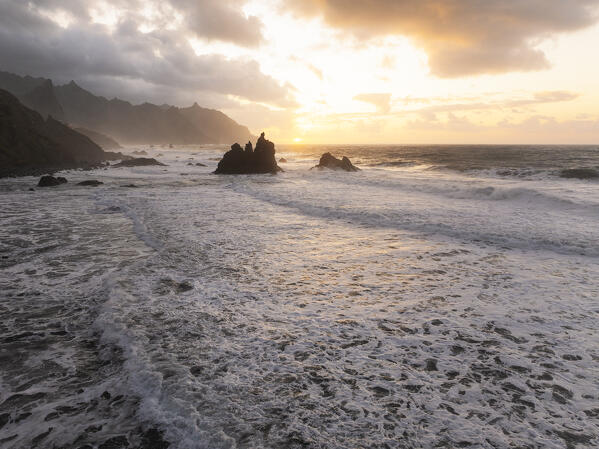 aerial view taken by drone of the famous rock on Benijo beach during a sunrise, Tenerife, Canary Island, Spain, Europe