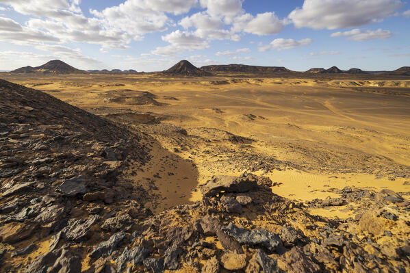 the beautiful landscape of the Black Desert during a sunny day, Egypt, Africa