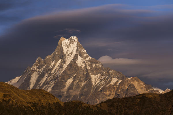 Lenticular clouds forming above Machapuchare, Himalayas, Nepal
