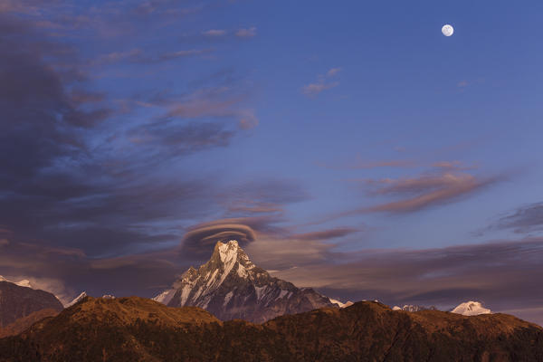 Lenticular clouds at sunset above Machapuchare, Himalayas, Nepal