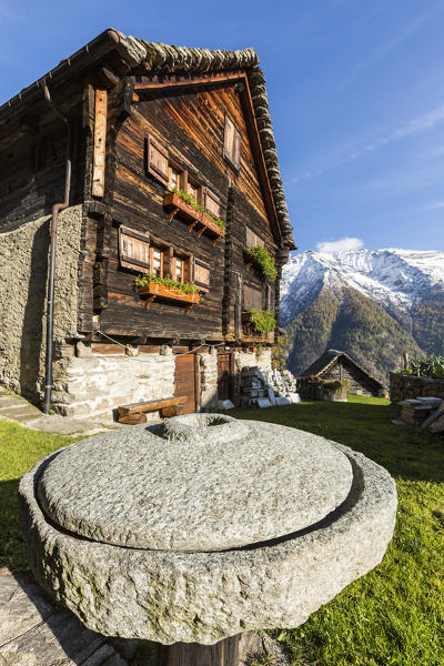Wood facade of walser house with the Alps in background, Salecchio, Val Formazza, Verbano Cusio Ossola province, Piedmont, Italy