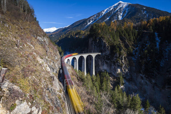 Bernina Express train on Landwasser Viaduct in autumn, Filisur, canton of Graubunden, Switzerland