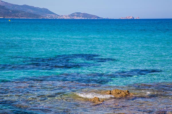 France, the clean water from Ostriconi beach on the Balagne, Corse, in the background the ile Rousse