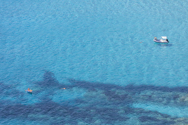 Bathers in the clear sea close to Menasina beach (plage de Menasina), Cargese, Corsica, France