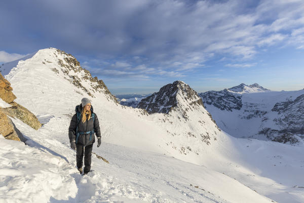 A woman walking at Passo Presena, Trento, Val Presena, Trentino Alto Adige, Italy, Southern Europe