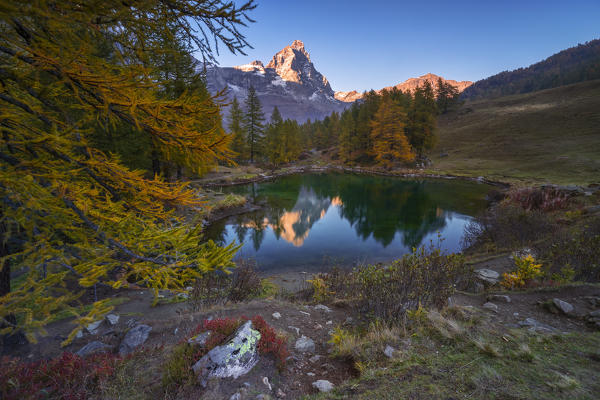A view of Cervino and Blue lake at sunset during autumn, Breuil-Cervinia, Aosta, Valtournenche, Valle D'Aosta, Italy, Southern Europe