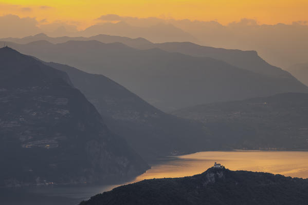 A view of Madonna della Ceriola Sanctuary and Iseo lake at sunset, Siviano, Monte Isola, Iseo lake, Brescia, Lombardy, Italy, Southern Europe