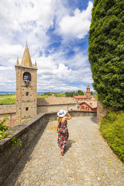 A woman walks in front of San Sebastiano's Church at Serralunga D'Alba, Cuneo, Langhe e Roero, Piedmont, Italy, Southern Europe (MR)
