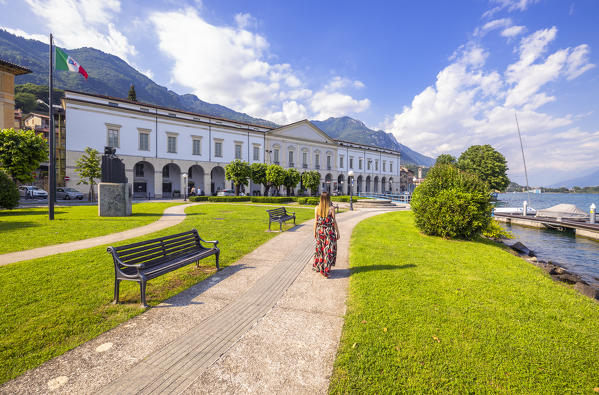 Woman walks in front of Palazzo Tadini at Lovere, Iseo lake, Val Seriana, Bergamo, Lombardy, Italy, Southern Europe