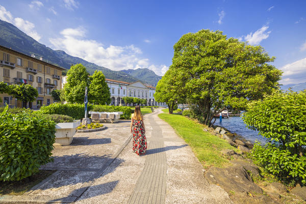 Woman walks in front of Palazzo Tadini at Lovere, Iseo lake, Val Seriana, Bergamo, Lombardy, Italy, Southern Europe