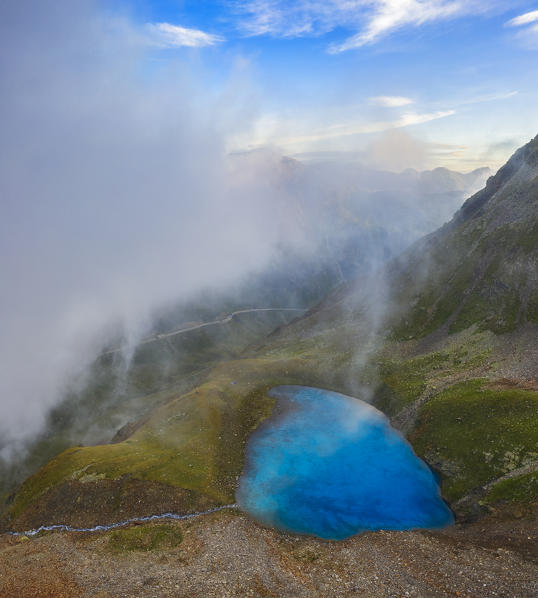 Aerial view of Vago lake during misty summer morning, Livigno, Lombardy, Italy, Southern Europe