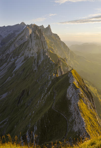 A man at Schafler ridge at sunset during summer, Wasserauen, Canton Appenzell Innerrhoden, Alpstein, Schwende, Switzerland, Western Europe
