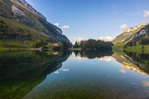 Berggasthaus Seealpsee reflected at sunset during summer, Wasserauen, Canton Appenzell Innerrhoden, Alpstein, Schwende, Switzerland, Western Europe