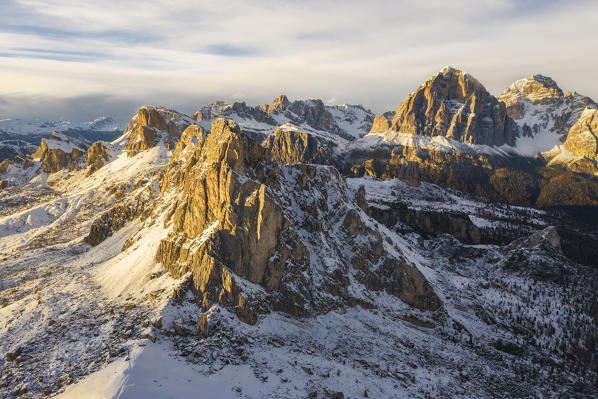 Aerial view of Passo Giau at sunset during autumn with snow, Belluno, San Vito di Cadore, Ampezzo Dolomites, Veneto, Italy, Western Europe