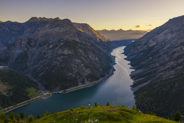 Aerial view of two guys at Crap de La Parè at sunrise, Livigno,  Sondrio, Valtellina, Lombardy, Italy, Southern Europe