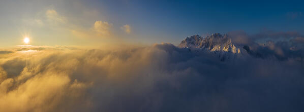 Aerial view of Presolana mountain at sunset over the clouds, Castione della Presolana, Bergamo, Lombardy, Italy, Southern Europe