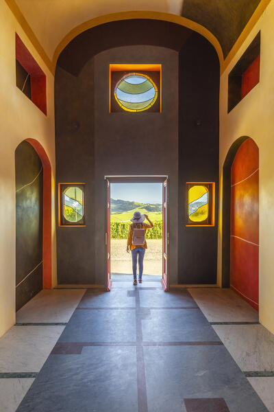 A woman inside Cappella del Barolo at sunset, La Morra, Cuneo, Langhe e Roero, Piedmont, Italy, Southern Europe (MR)