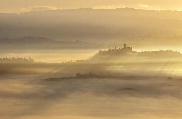 Foggy morning at Castiglione Falletto during autumn at sunrise, Cuneo, Langhe e Roero, Piedmont, Italy, Southern Europe
