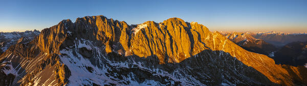 Aerial view of Presolana and Adamello Group at sunset during winter, Castione della Pesolana, Prealpi Orobie, Bergamo, Lombardy, Italy, Southern Europe