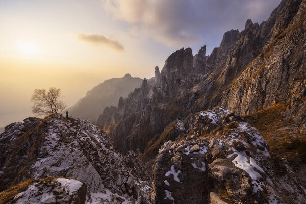 A photographer during sunset from Sentiero delle Foppe, Grignetta, Lecco, Lombardy, Italy, Southern Europe  