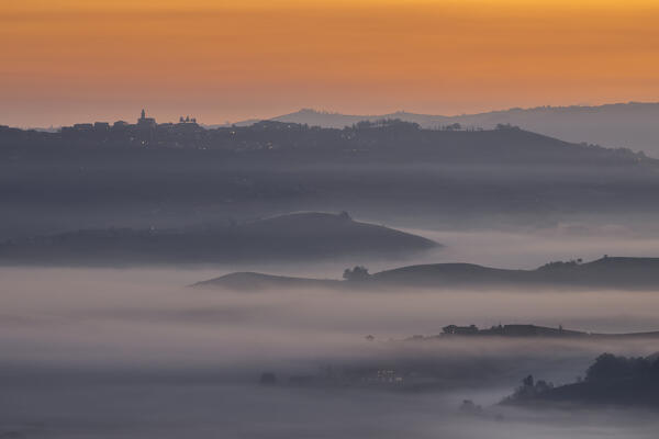 Foggy morning at Diano D'Alba during autumn at sunrise, Cuneo, Langhe e Roero, Piedmont, Italy, Southern Europe