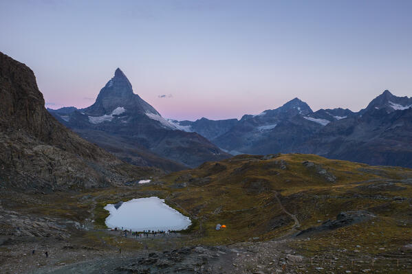 People at Rifflesee in front of Matterhorn at sunrise during summer, Zermatt, Canton of Valais, Visp, Switzerland, Western Europe