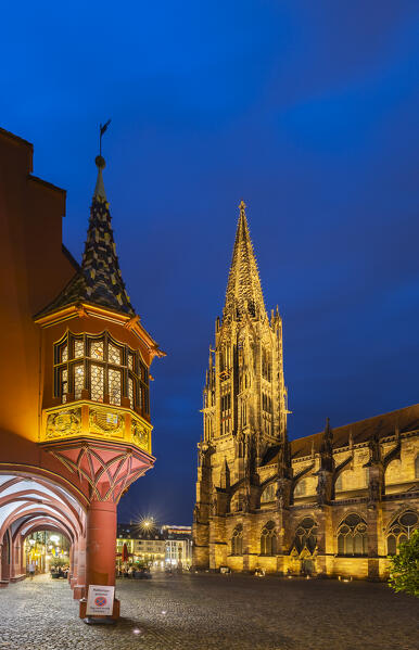 Illuminated Kaufhaus and Gothic Cathedral in Freiburg im Breisgau, Munsterplatz, Baden Wurttemberg, Germany, Deutschland, Western europe