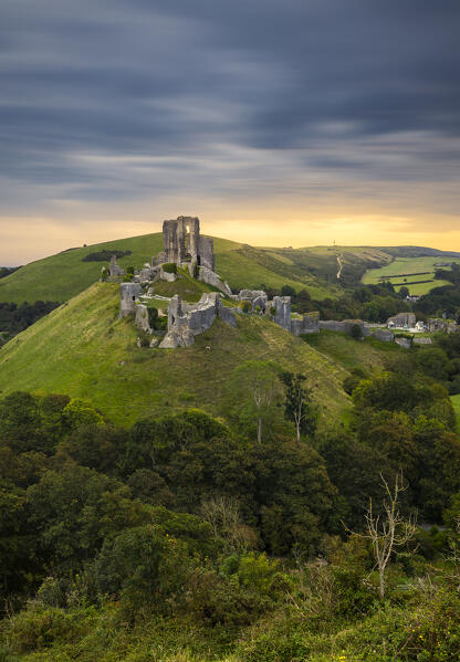 Corfe Castle portrayed from hills at sunrise, Corfe Castle, Purbeck, Dorset, England, Great Britain, United Kingdom