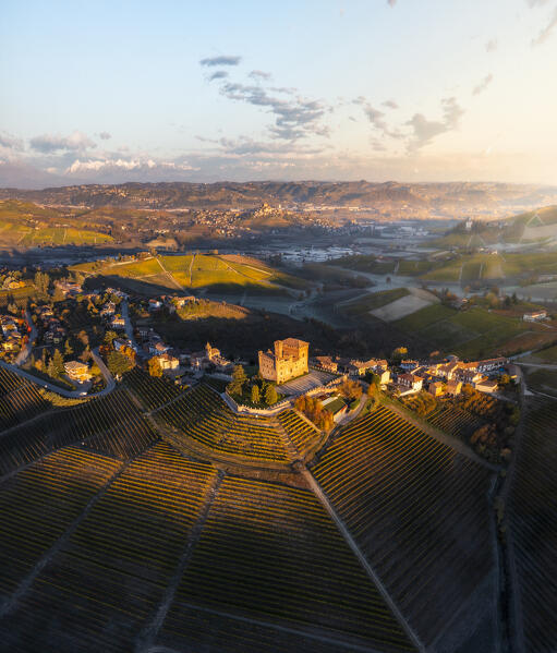 Aerial view of Grinzane Cavour at sunrise during  autumn, Cuneo, Langhe and Roero, Piedmont, Italy, Southern Europe
