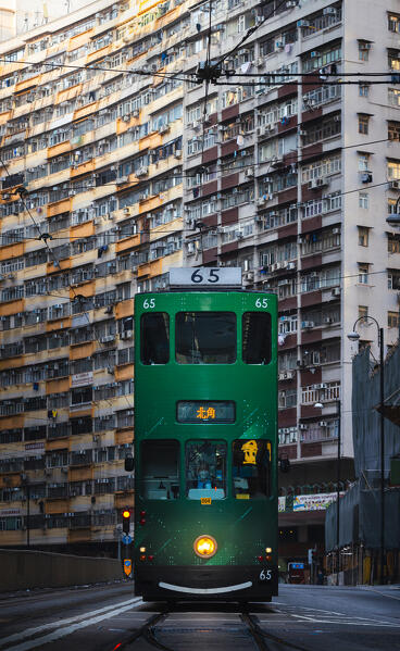 Green tram and Nam Tin building, North Point. Hong Kong, China, Asia