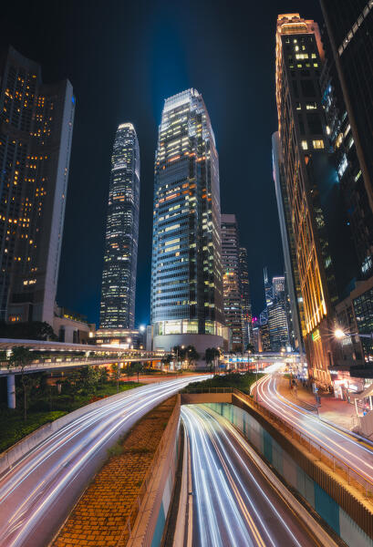 Light trails at Connaught road with One International Finance centre building at rush hour, Central District, Hong Kong, China, Asia