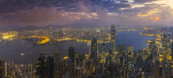 Elevated and panoramic view of Hong Kong cityscape viewed from Lugard road at dusk, The Peak, Hong Kong, China, Asia