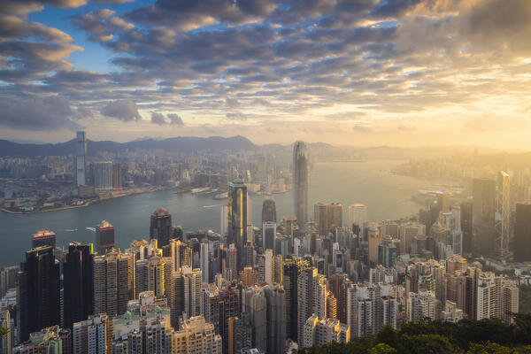 Elevated view of Hong Kong cityscape viewed from Lugard road during sunrise, The Peak, Hong Kong, China, Asia