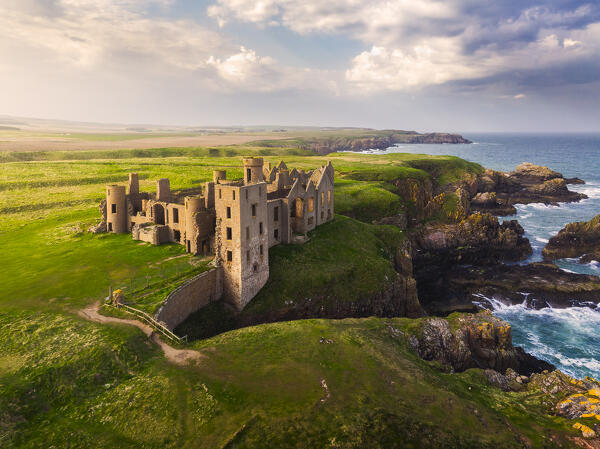Aerial view of Slains Castle at sunset, Cruden Bay, Aberdeenshire, Scotland, United Kingdom