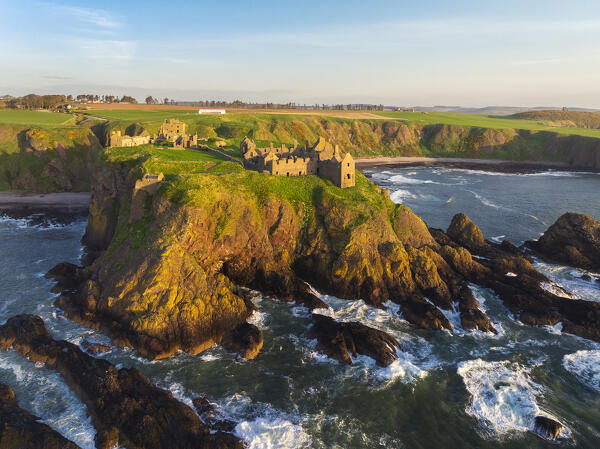 Aerial view of Dunnnottar Castle at sunrise, Stonehaven, Aberdeenshire, Scotland, United Kingdom