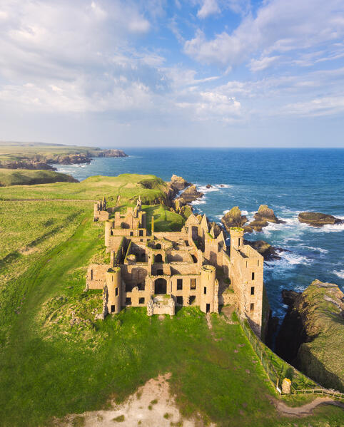 Aerial view of Slains Castle at sunset, Cruden Bay, Aberdeenshire, Scotland, United Kingdom