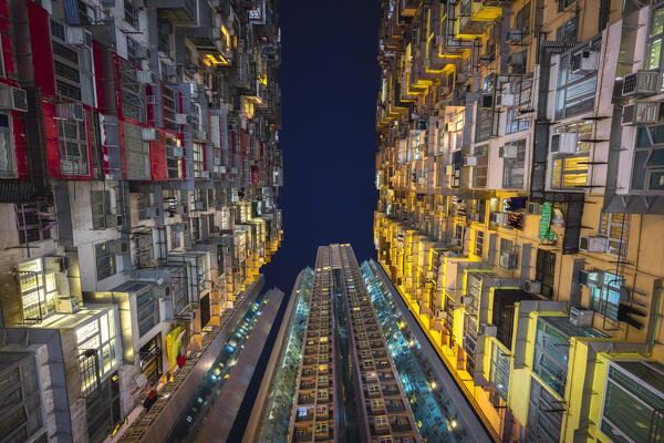 Illuminated Monster Buildings during night, Quarry Bay. Hong Kong, China, Asia