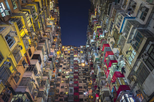 Illuminated Monster Buildings during night, Quarry Bay. Hong Kong, China, Asia