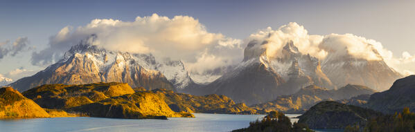 Panoramic view of Lake Pehoe and Cuernos del Paine in the background during sunrise, Torres del Paine NP, Ultima Esperanza, Region de Magallanes y de la Antartica Chilena, Patagonia, Chile, South America
