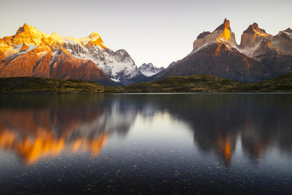 Cuernos del Paine reflected in Lake Nordenskjold during sunrise, Torres del Paine NP, Ultima Esperanza, Region de Magallanes y de la Antartica Chilena, Patagonia, Chile, South America